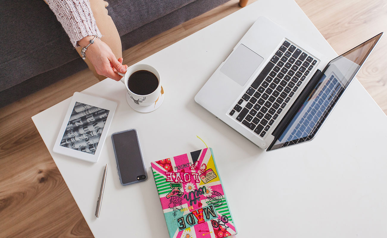 The Rise of Side Hustles: How Gen Z Is Redefining Work top view laptop coffee table 1